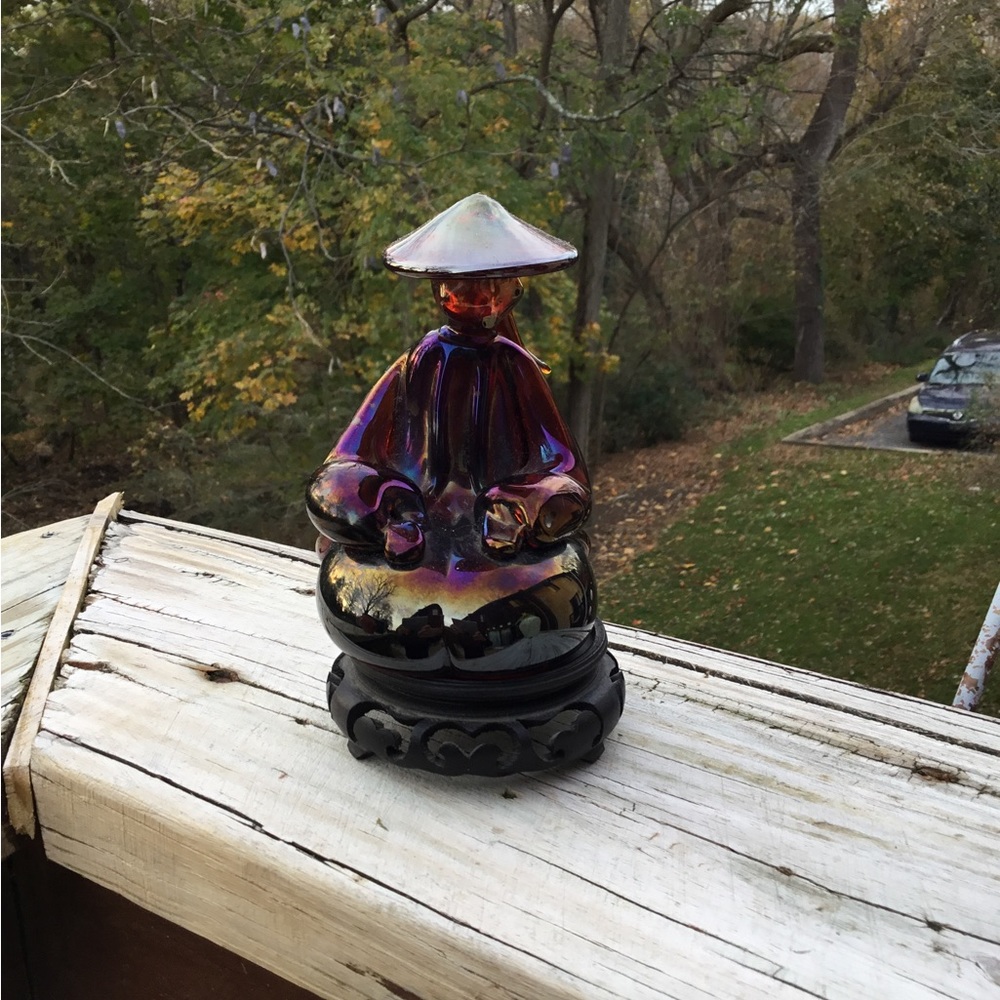 Heavy, solid glass of an Asian woman seated